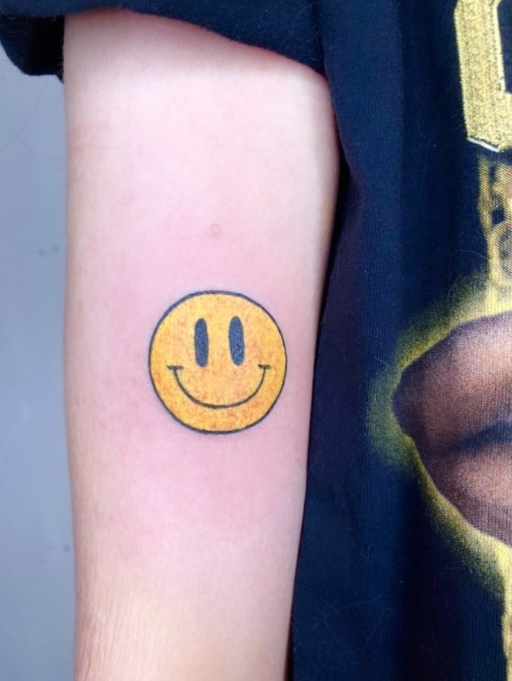 smiling face tattoo