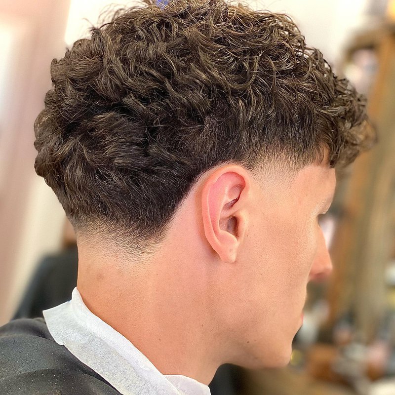 mid taper fade curly hair