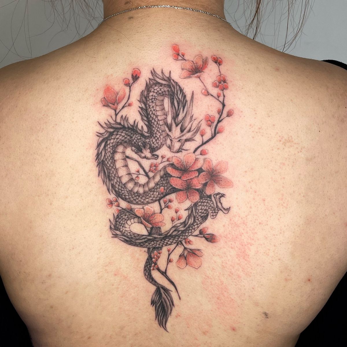 dragon tattoo with cherry blossoms