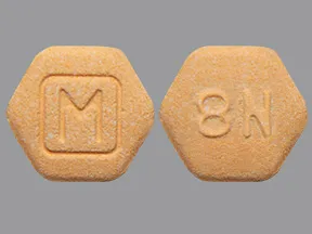 orange hexagon suboxone pill with m on it