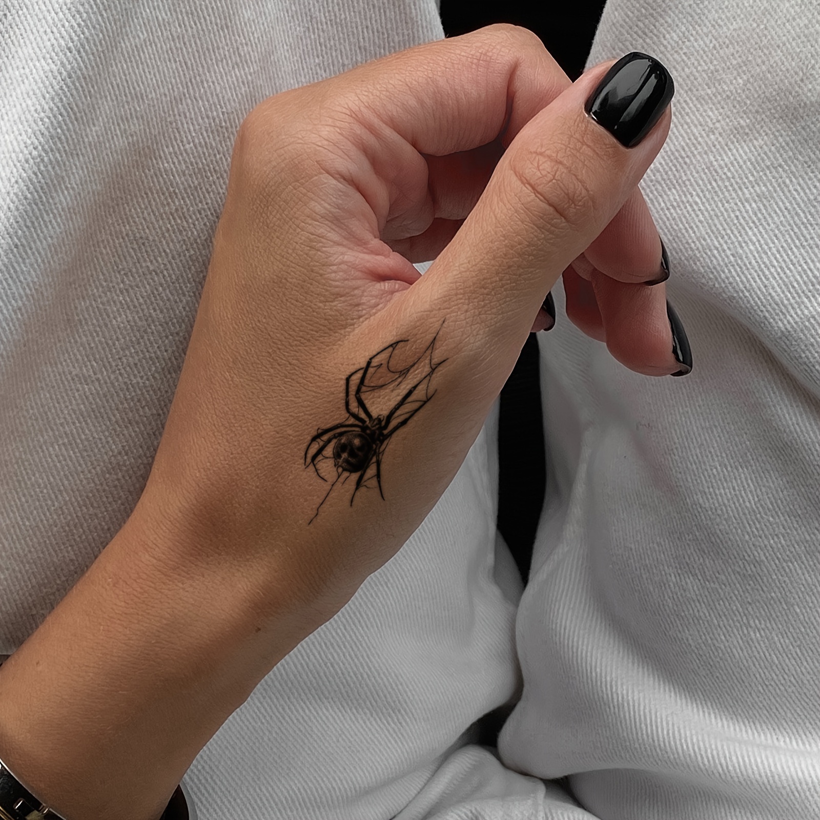 spider tattoo on hand