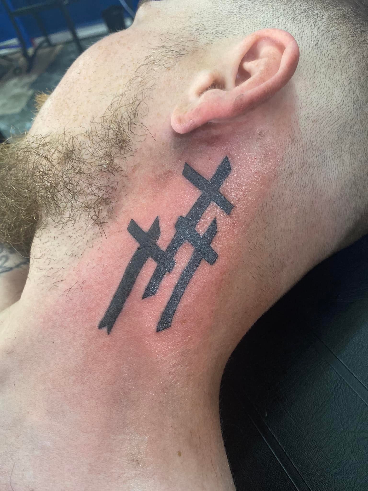 3 cross tattoo on neck