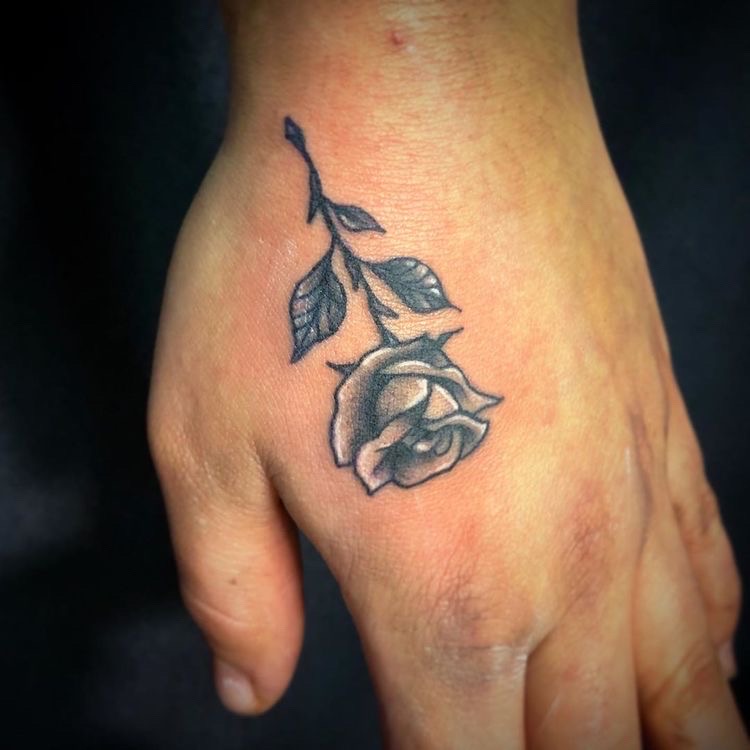 rose tattoo on hand