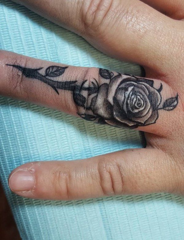 rose finger tattoo