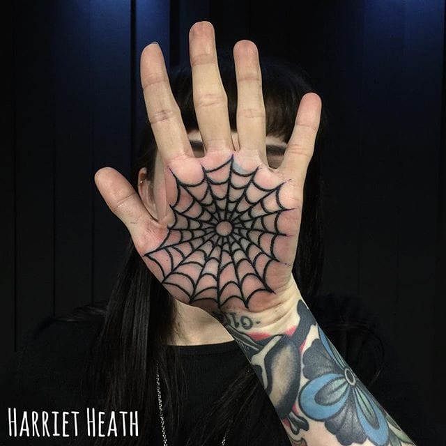 spider web hand tattoo