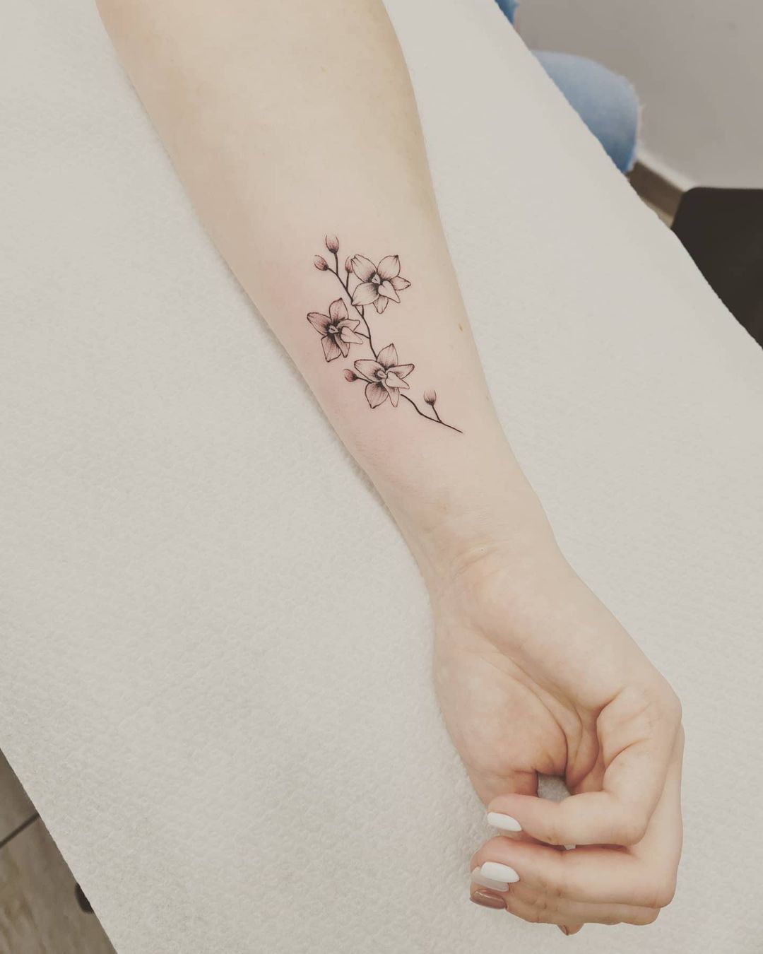 minimalist orchid tattoo