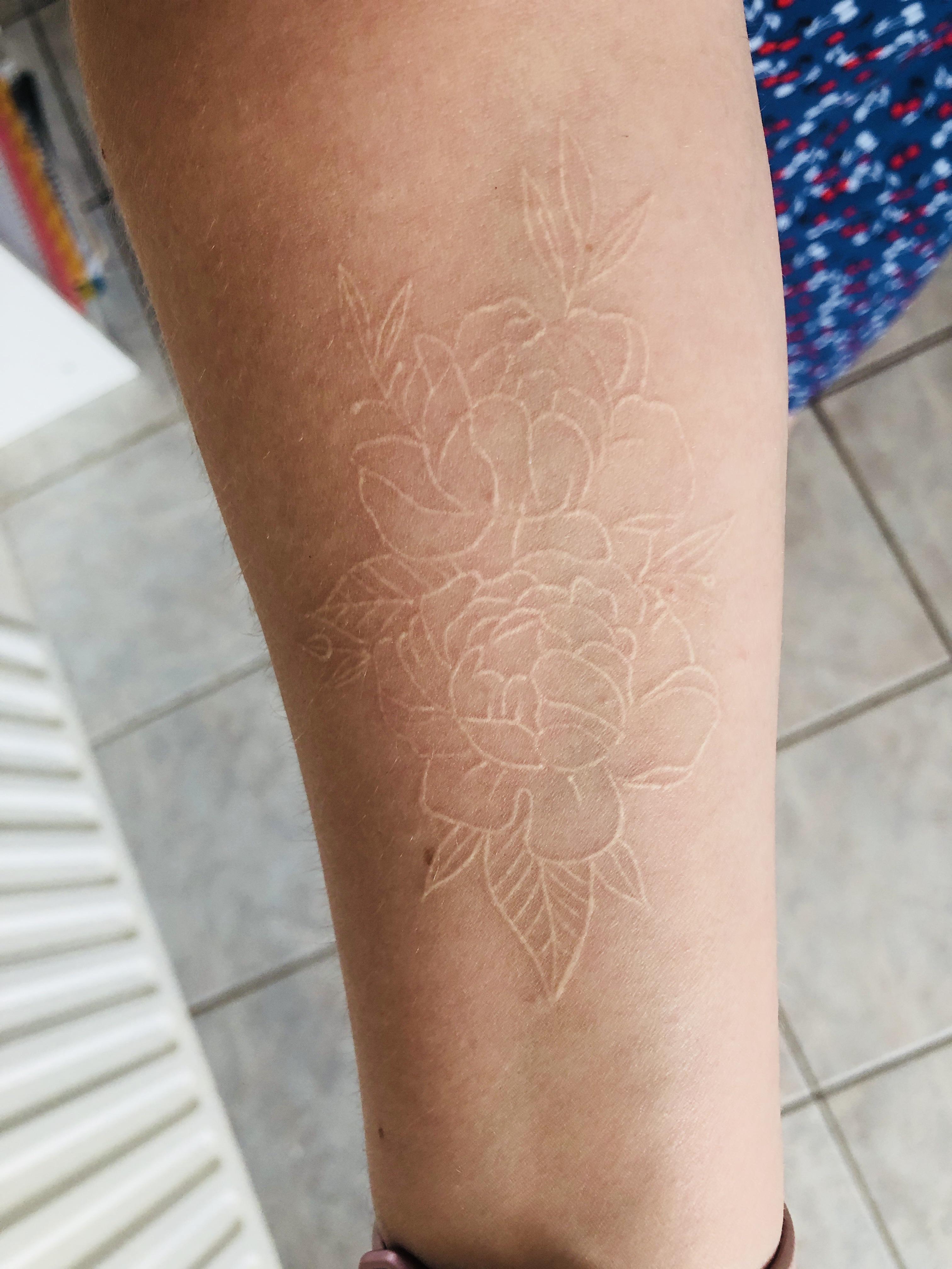 aged badly white ink tattoo