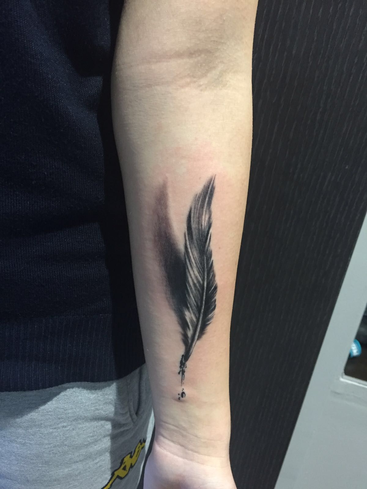 feather tattoo black and grey