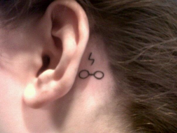 glasses tattoo behind ear meaning