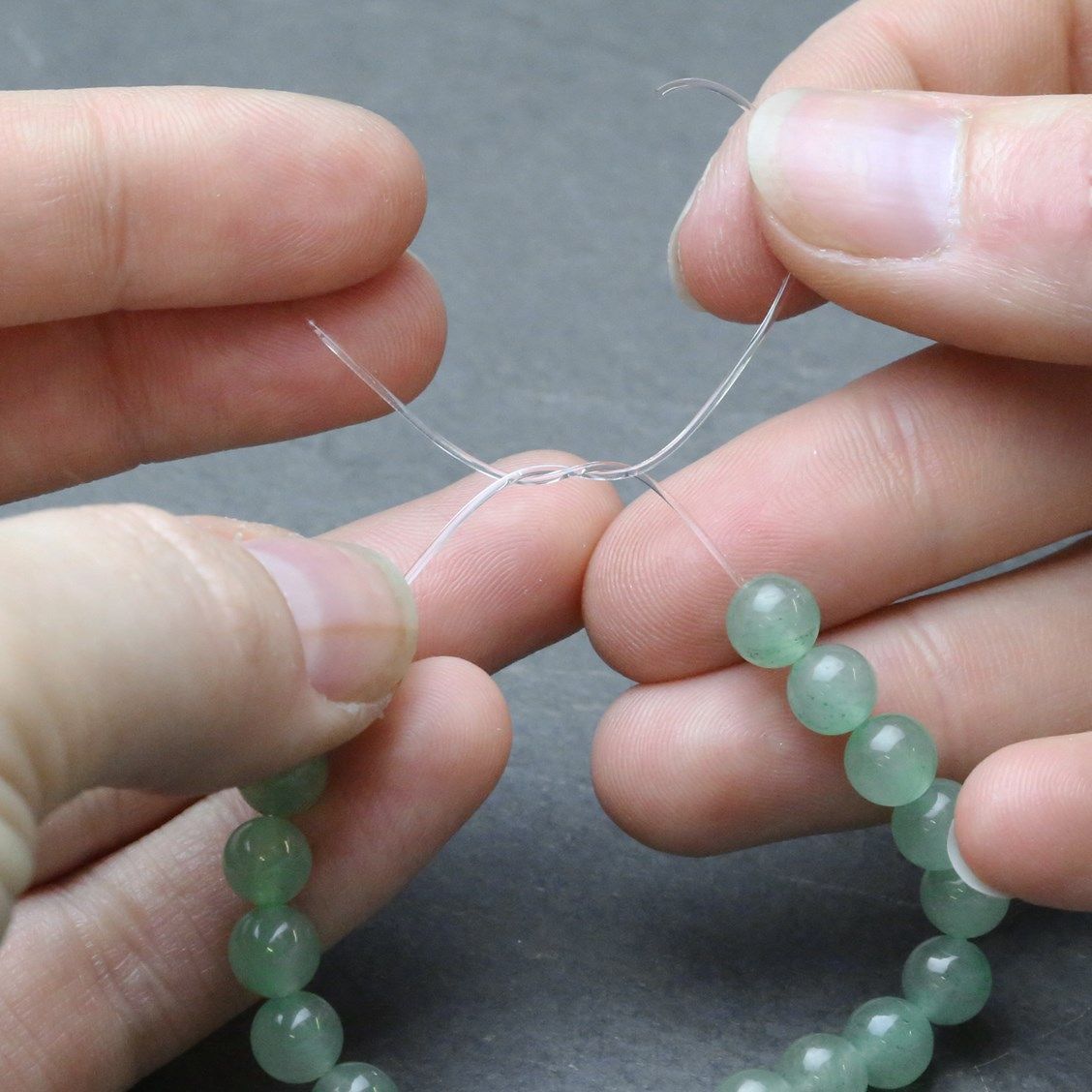 how to tie a clear string bracelet