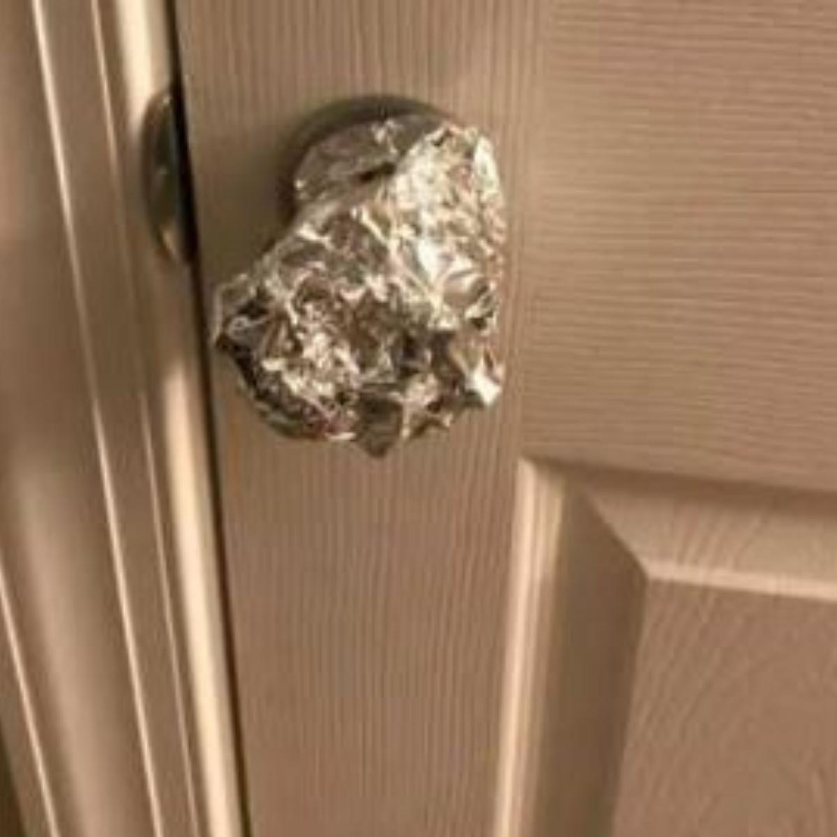 why wrap tin foil around door knobs